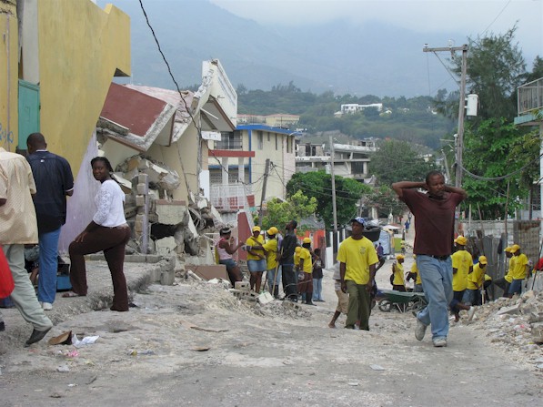 Work teams clearing rubble in P-A-P.